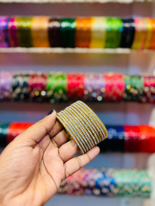 Gold with white stone border bangles